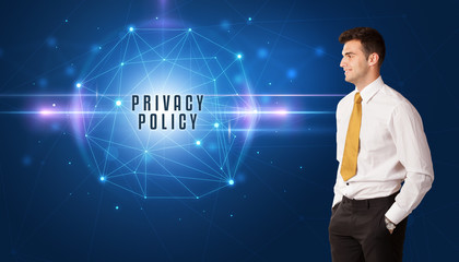 Businessman thinking about security solutions with PRIVACY POLICY inscription