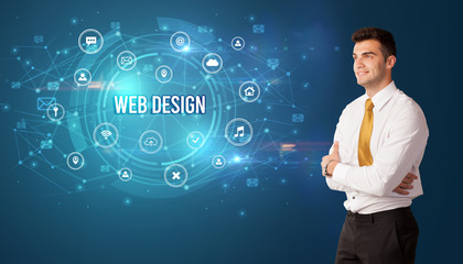 Businessman thinking in front of technology related icons and WEB DESIGN inscription, modern technology concept