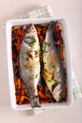 Baked sea bass fish with vegetables