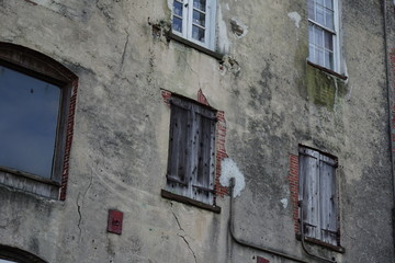 old brick wall with windows