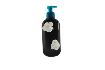 Shampoo in a black bottle on a white background. Hair conditioner in a bottle with a dispenser. Body care cosmetic.