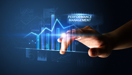 Hand touching PERFORMANCE MANAGEMENT button, business concept