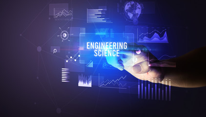 Hand touching ENGINEERING SCIENCE inscription, new business technology concept