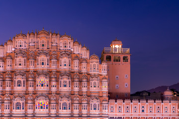 Fototapeta na wymiar Hawa Mahal, Jaipur, Rajasthan, India, a five-tier harem wing of the palace complex of the Maharaja of Jaipur, built of pink sandstone in the form of the crown of Krishna, Palace of the Winds