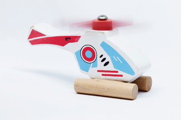 wooden toy helicopter with rotating wing blade