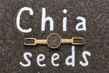 Written word Chia seeds on a dark background