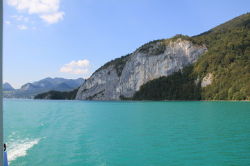 Fototapeta premium cliffs on blue lake in mountians