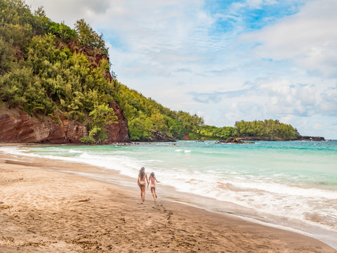 Koki Beach Park Maui. The dark red sand at Koki Beach was produced by the nearby cinder cone hill of Ka Iwi O Pele. Koki Beach is one of two famous Hana surf breaks and favorite spot for local surfers