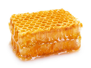 Honeycomb with honey on white background