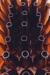 Close-up of beer bottles, focus on middle one, isolated on white background.