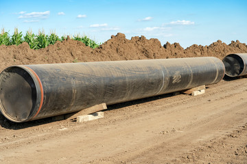 Natural Gas Pipe Sections Ready to be Assembled at Pipeline Construction Site