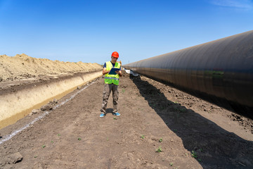 Engineer Checking Petrochemical Gas Pipeline at Construction Site - Turkish Stream