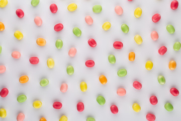 Small round candy-colored pastels on pastel background.