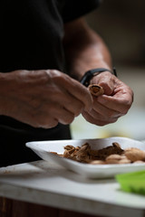 senior man's hands peeling