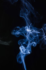 Obraz premium Blue smoke on black background