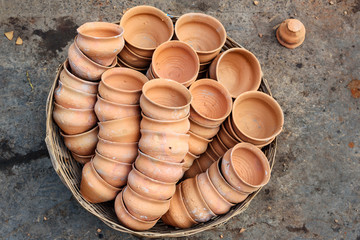 Clay cups in basket on the street. Kolkata. India