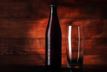 full bottle of beer with beer mug
