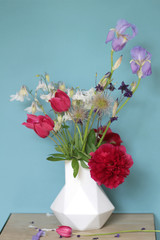 Bunch of tulips and peony boho style architects vase geometric  complementary contrast