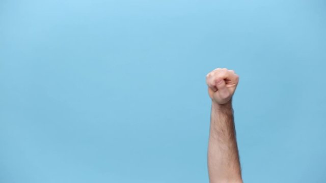 Close up cropped man hand fists knocking door gesture isolated over blue background studio. Copy space for advertisement. With place for text or image. Advertising area, mock up. Knock-knock who there