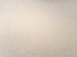 Top view fine sandy beach,Background with copy space and visible sand texture.