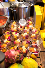 Fresh sliced fruits in a glass
