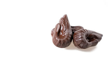 spoiled chocolates coated with white coating on a white background. greasy chocolate