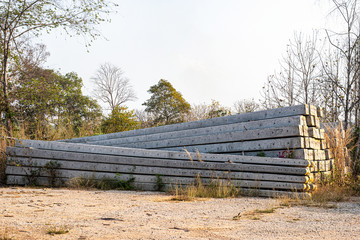 Stacked concrete electric pole on the ground