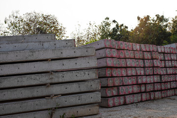 Stacked concrete electric pole on the ground