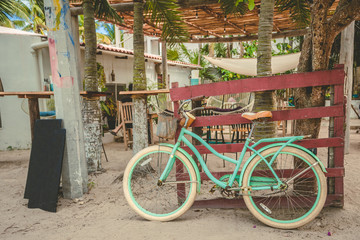 Fototapeta na wymiar Vintage and stylish Bicycle on fence outdoor