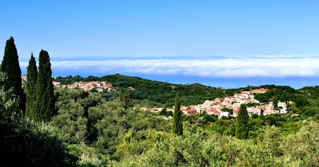 Fototapeta na wymiar Corfu village and morning mist