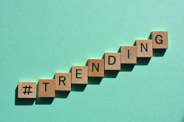 Hash tag symbol and the word trending on green background