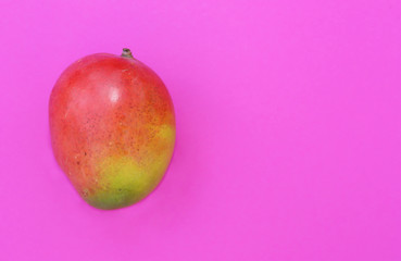 Tropical fruit mango on pink background.