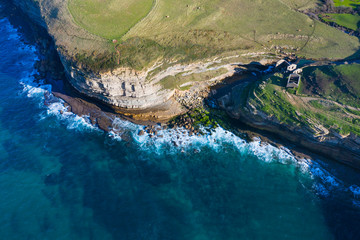 Cliffs and Mill of El Bolao, Cóbreces, Alfoz de Loredo Municipality, Cantabrian Sea, Cantabria, Spain, Europe
