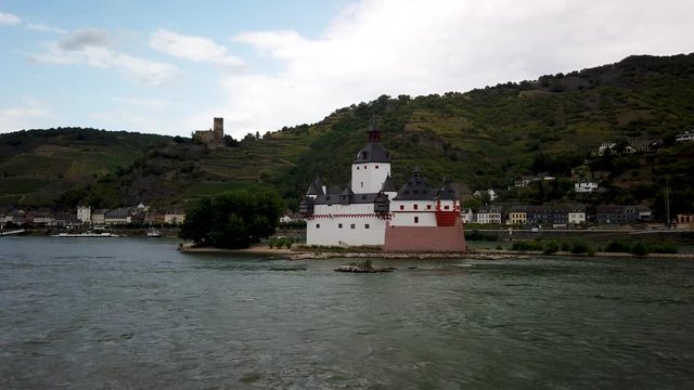 Passing Pfalzgrafenstein Castle on the Rhine River,  a toll castle on the Falkenau island, otherwise known as Pfalz Island in the Rhine river near Kab, Germany