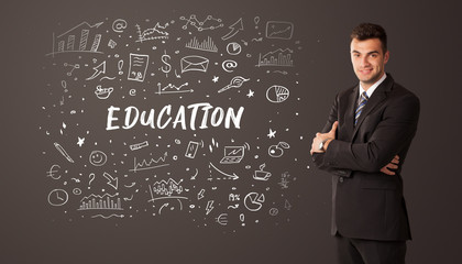 Businessman thinking with EDUCATION inscription, business education concept