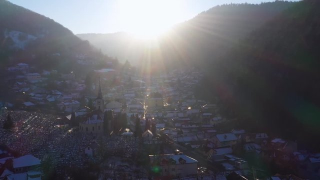 Aerial drone 4k clip of Brasov historical neighborhood Schei at sunset on a beautiful winter day
