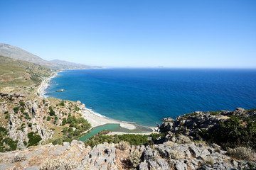 Fototapeta na wymiar Panorama of Preveli beach at Libyan sea, river and palm forest, southern Crete , Greece.