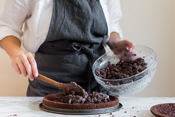 Woman making cake in her kitchen