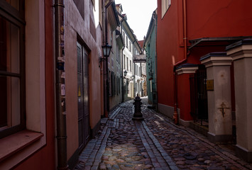 April 24, 2018 Riga, Latvia. Colorful houses on the narrow street of the Old Town in Riga.