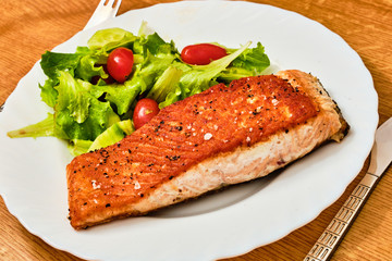 Cooked salmon fillet on plate