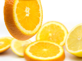 Set of ripe lemon and orange fruits isolated on white background.