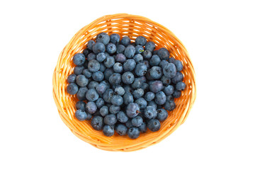 Ripe delicious blueberries close up in basket isolated on white background. Flat lay or top view. 