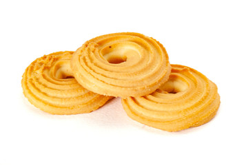 Round spritz shortbread isolated on white background. Danish butter cookies on white.