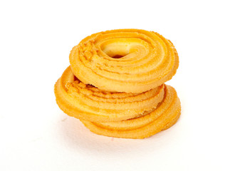 Round spritz shortbread isolated on white background. Danish butter cookies on white.