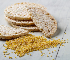 millet seeds and bread rolls on the table