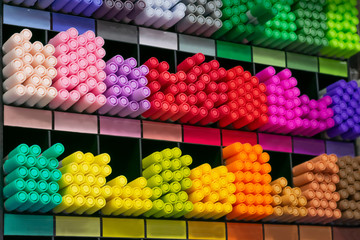 Group of multicolored felt-tip pens as school, colledge and university tools on shells. Colorful pencils for drawing and sketching in shop.