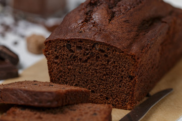 Sliced homemade chocolate banana pound cake loaf. Delicious dessert for Breakfast. A treat for tea. Selective focus