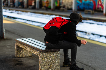 Travelers and commuters waiting for a train on the train platform at Bucharest North Railway...