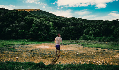 single person walk alone on the wide nature landscape