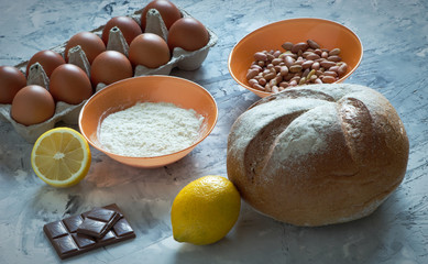 Ingredients for cooking bread Cooking concept. Wheat dough and with eggs and peanut with lemon and orange